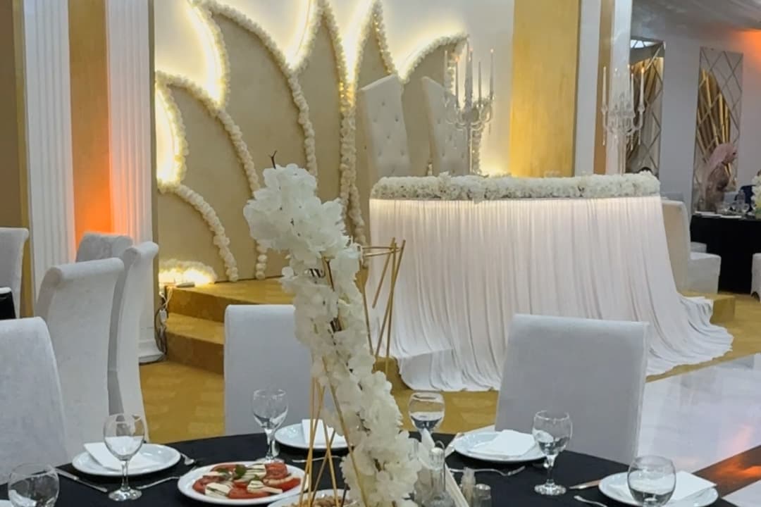 The Salon with gilded details and warm candlelight